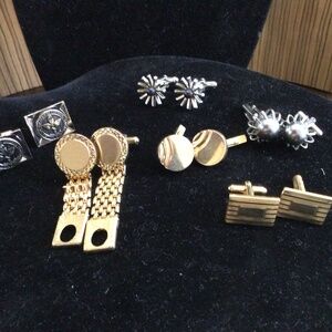 6 pair of cufflinks. All wearable. One says Shank